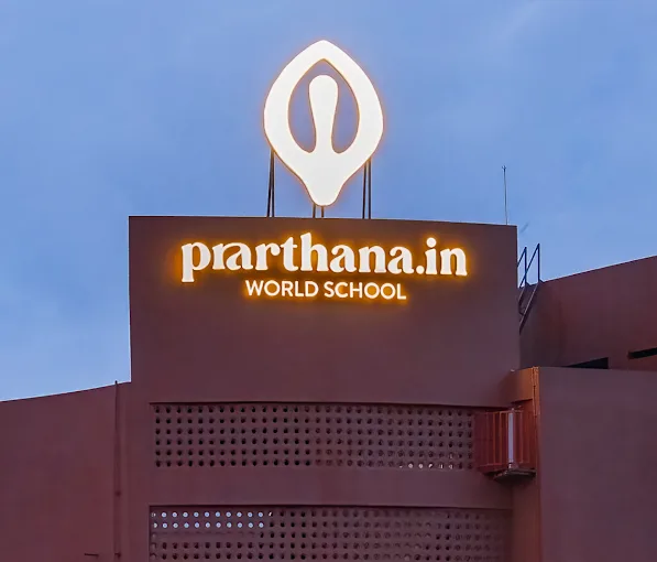 Liber Restobar illuminated entrance sign with a dimensional macaw and letters